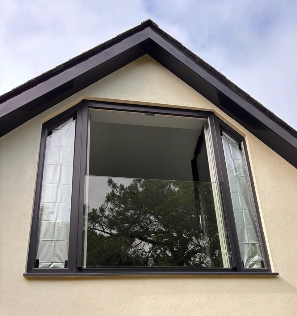 Juliet Balcony across the upstairs window of a house - Revive Balustrade across Dorset, Hampshire and Berkshire